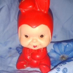 Antique Squeaky baby in a red bunny suit